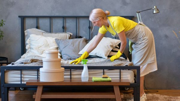 An imagine showing a cleaner cleaning a holiday rental property