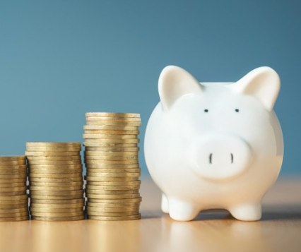 An image showing improving holiday rental income, as represented by a piggy bank