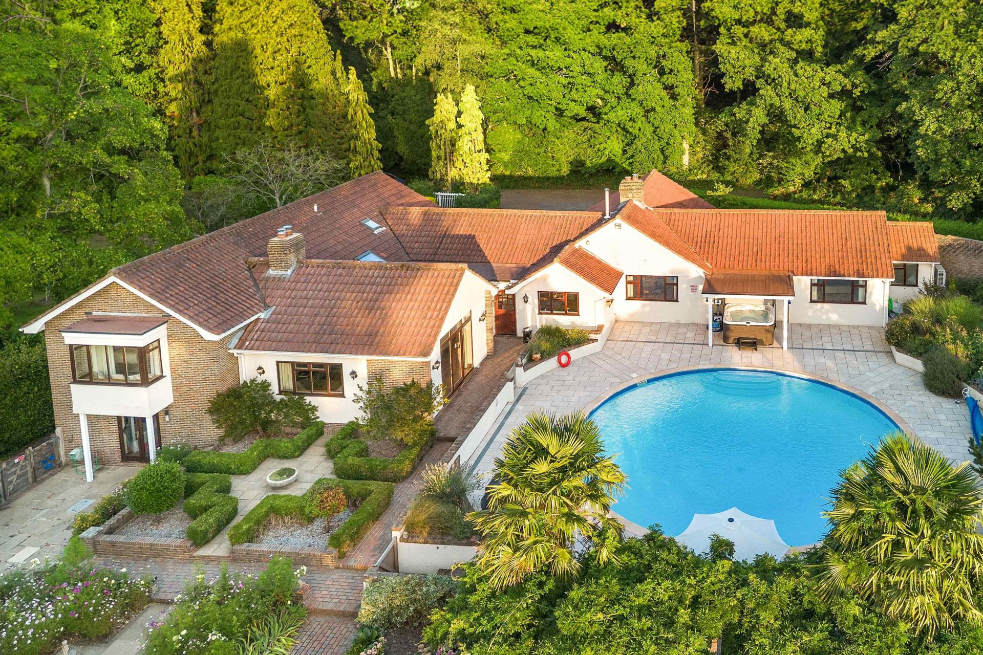 Aerial view of Churchill Country Retreat with heated pool and gardens, North Chailey, East Sussex