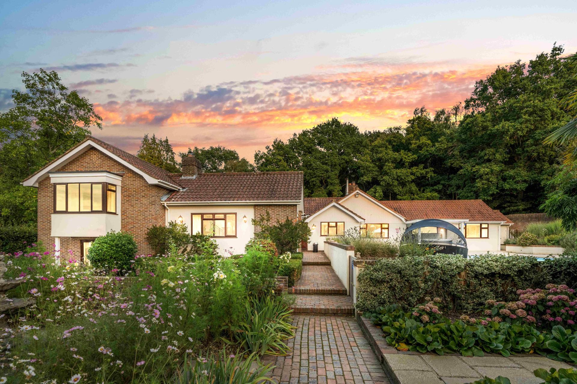 Churchill Country Retreat holiday home at dusk, Chailey, East Sussex